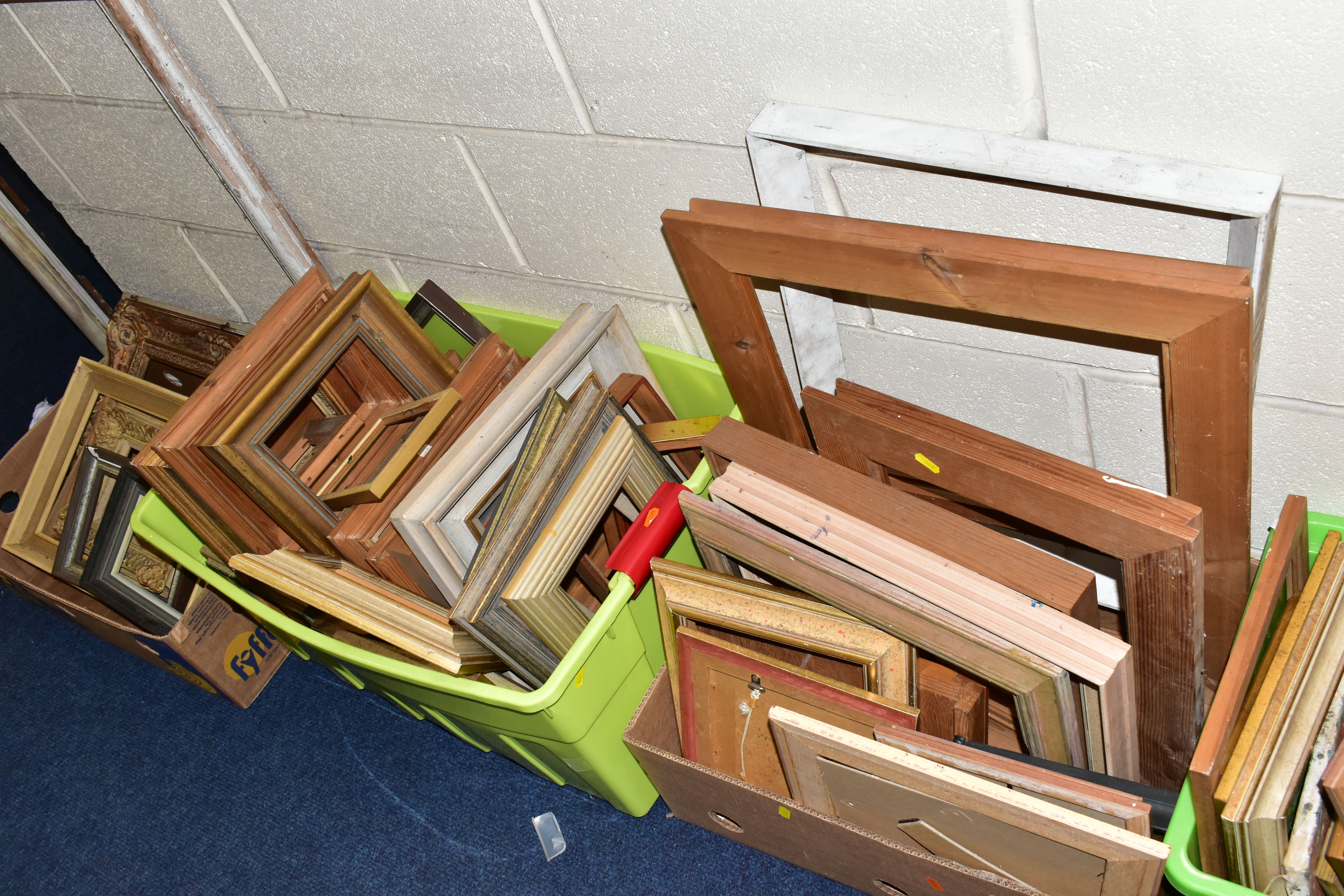 A QUANTITY OF WOODEN PICTURE FRAMES, assorted shapes and sizes, together with a small number of