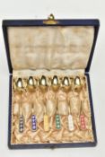 A CASED SET OF SIX SILVER GILT AND ENAMEL HARLEQUIN COFFEE SPOONS, marked 'Ela DENMARK STERLING