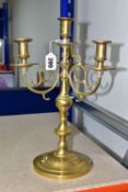 A BRASS FOUR FLAME CANDELABRA, circular base, scroll effect branches, height 35cm (1) (Condition