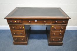 A VICTORIAN MAHOGANY PEDESTAL DESK, with black leatherette writing surface, with nine drawers (