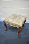 A VICTORIAN WALNUT SQUARE FOOT STOOL, with floral needle work upholstery, 50cm squared x height 46cm