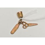 A YELLOW METAL CHARM, a rolled gold charm suspending a pair of scissors, thimble and pen knife,