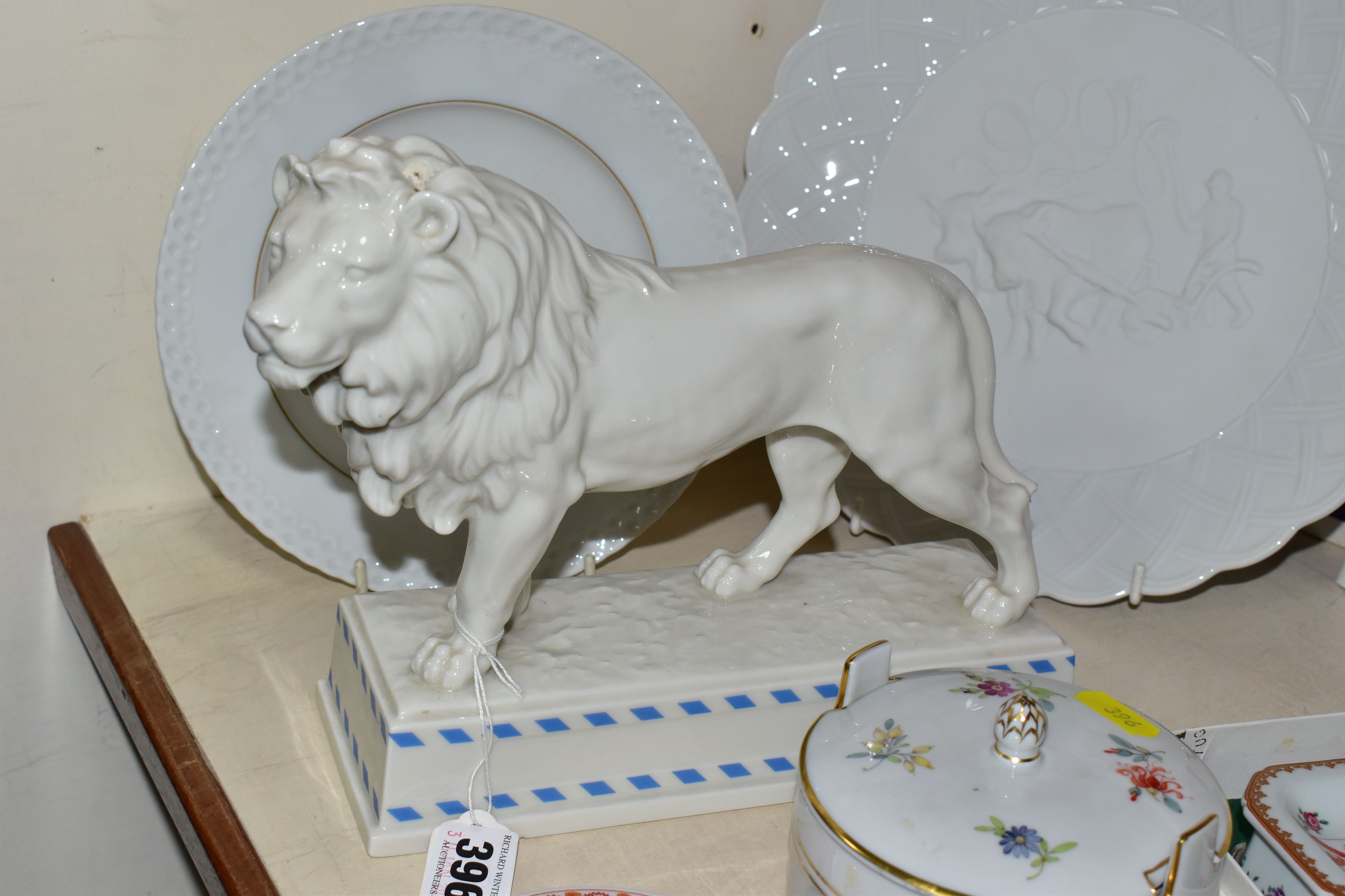 A GROUP OF PORCELAIN ITEMS, to include a white Hutschenreuther lion figure standing on a rectangular - Image 2 of 5