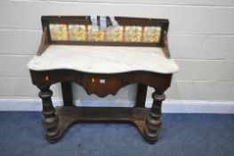 A LATE VICTORIAN MAHOGANY SERPENTINE WASHSTAND, with a marble top and a tiled raised back, above a