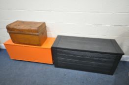 A BLACK PLASTIC GARDEN STORAGE BOX, 118cm x depth 45cm x height 57cm, a vintage tin trunk, and an