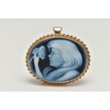 A 9CT GOLD CAMEO BROOCH, blue agate laser carved to depict a girl with a flower, set in a yellow