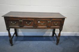 A GEORGIAN OAK DRESSER BASE, with two deep frieze drawers, on turned front legs, united by