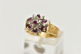 AN 18CT GOLD RUBY AND DIAMOND CLUSTER RING, designed as a tiered cluster set throughout with