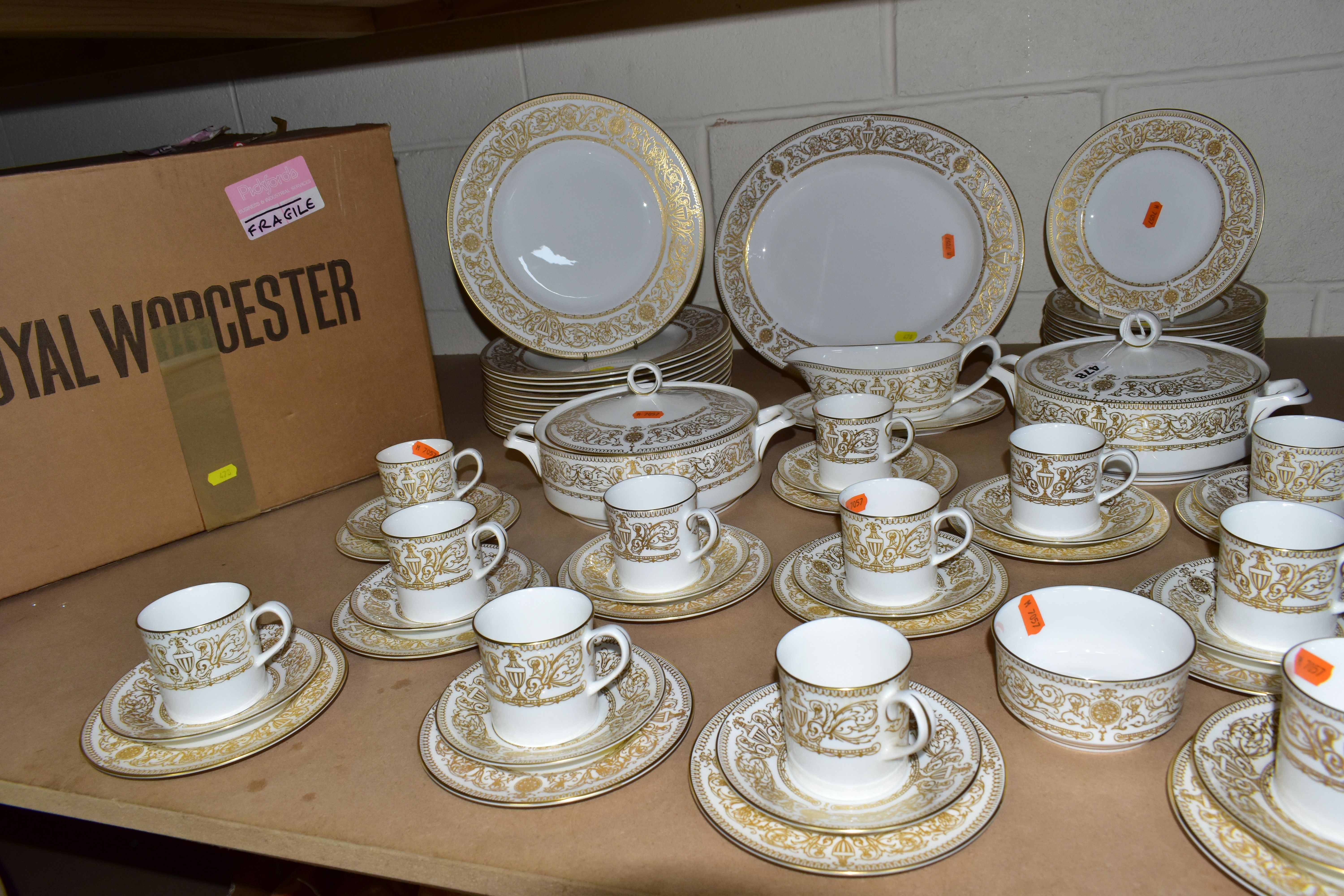A SIXTY SIX PIECE BOXED ROYAL WORCESTER 'HYDE PARK' PART DINNER SERVICE, with raised gilt pattern on