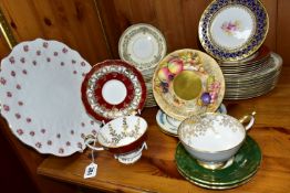 A GROUP OF AYNSLEY TEA AND DINNERWARES, to include a burgundy teacup with raised foot and matching