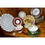 A GROUP OF AYNSLEY TEA AND DINNERWARES, to include a burgundy teacup with raised foot and matching