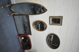 A GILT OVAL CHEVAL MIRROR (missing gilt) a gilt oval wall mirror, an oak oval mirror, a small