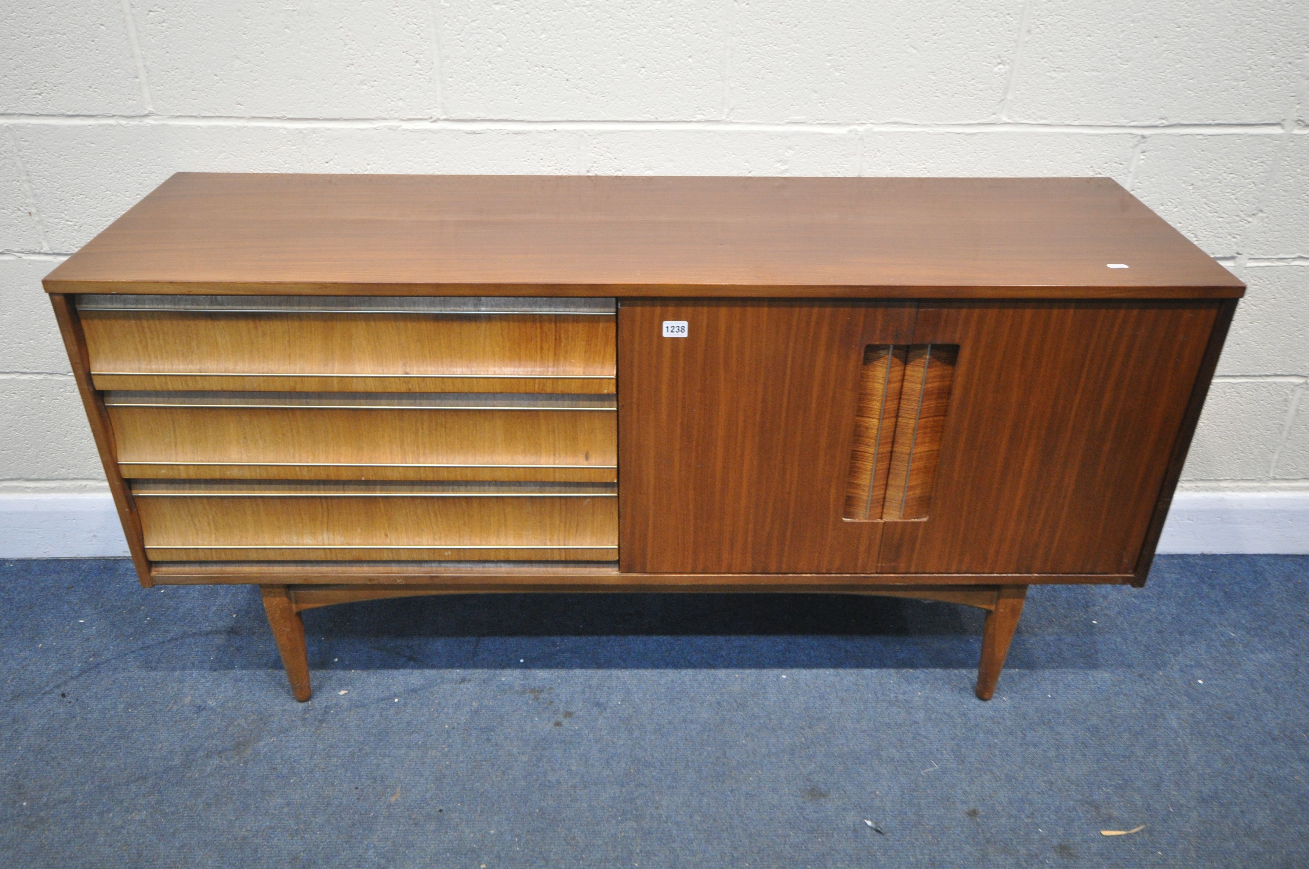 A MID CENTURY TEAK SIDEBOARD, with three drawers, and two cupboard doors, length 152cm x depth