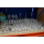 A QUANTITY OF CUT GLASS, comprising a set of six long stemmed wine glasses, sherry glasses,