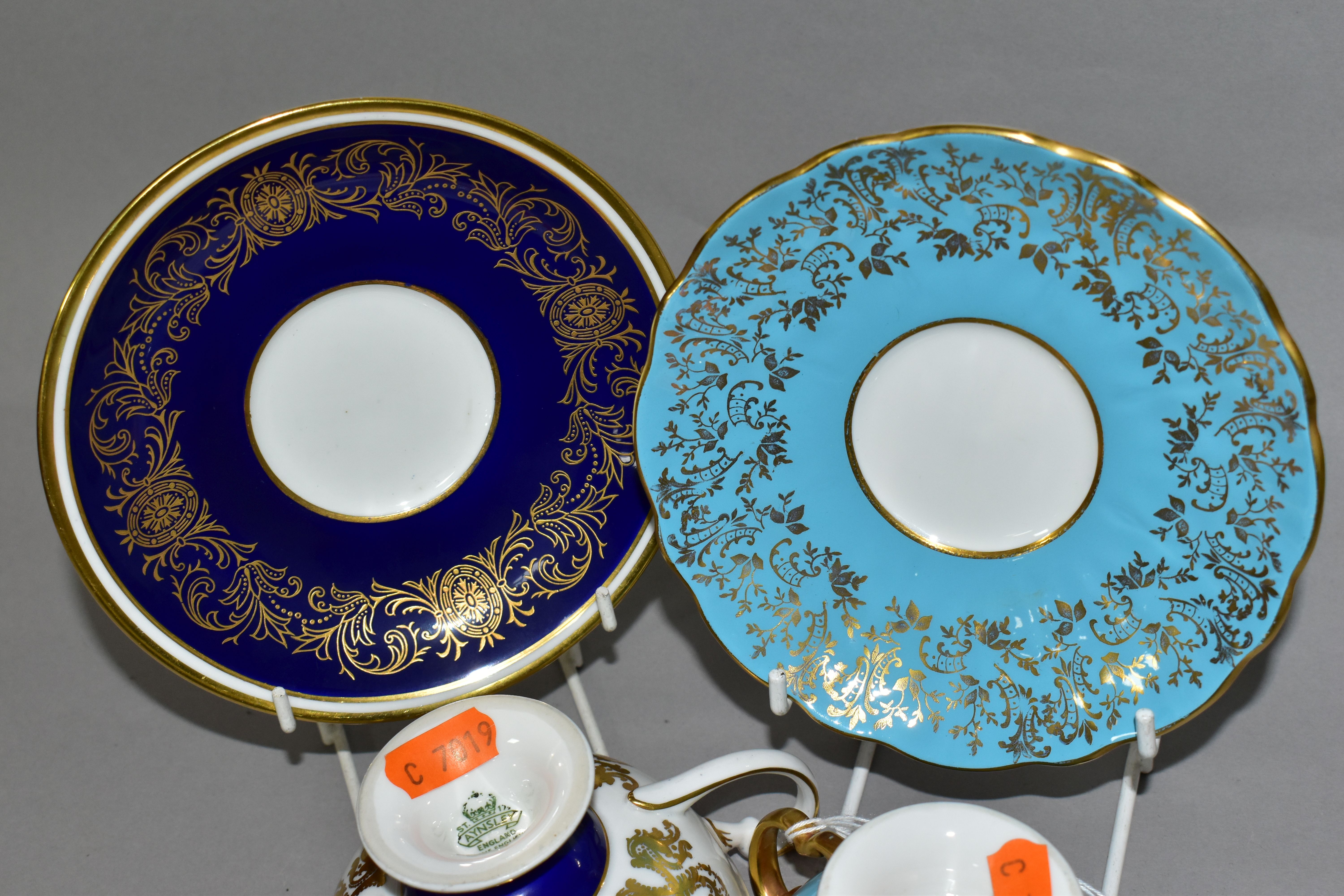 TWO AYNSLEY CABINET TEACUPS AND SAUCERS, comprising a turquoise cup and saucer, the interior of - Image 6 of 8