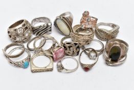 AN ASSORTMENT OF SILVER AND WHITE METAL RINGS, to include a silver ring set with a heart cut cubic