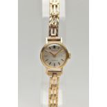 A LADIES 9CT GOLD 'ACCURIST' WRISTWATCH, manual wind, round silver dial signed 'Accurist, 21