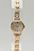 A LADIES 9CT GOLD 'ACCURIST' WRISTWATCH, manual wind, round silver dial signed 'Accurist, 21