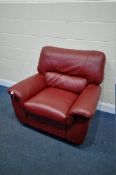 A RED LEATHER MANUAL RECLINING ARMCHAIR