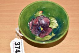 A MOORCROFT POTTERY SMALL FOOTED BOWL, of conical form, in Pansy pattern on a turquoise/green