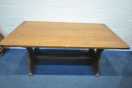 A RECTANGULAR OAK REFECTORY TABLE, with trestle style legs, with spade design to legs, united by a