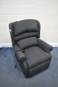 A HSL BLACK UPHOLSTERED RISE AND RECLINE ARMCHAIR (condition - slightly dirty, PAT pass and