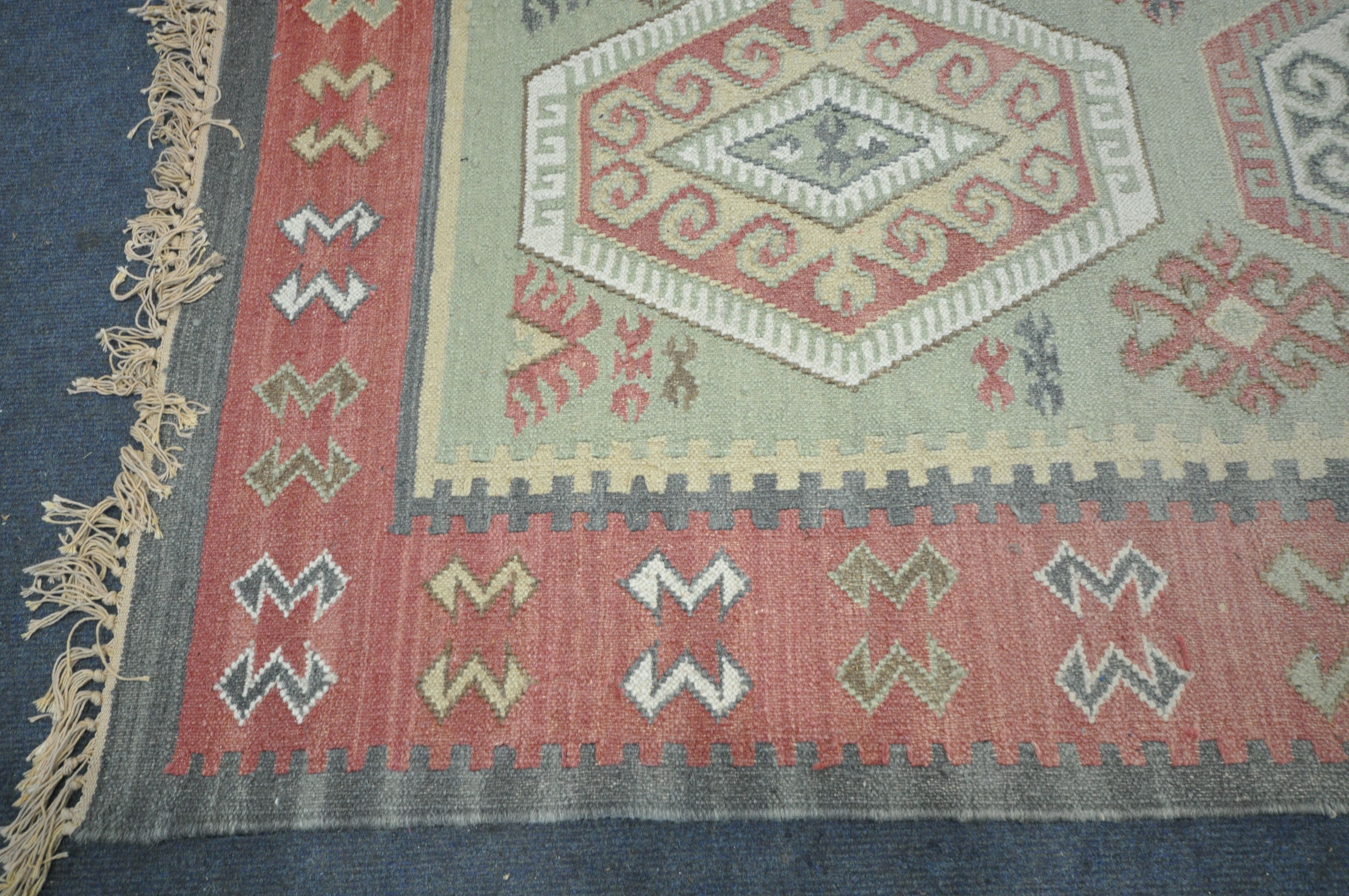 A 20TH CENTURY WOOLLEN MOROCCAN GEOMETRIC RUG, 240cm x 159cm, along with a modern blue rug, and a - Image 3 of 6