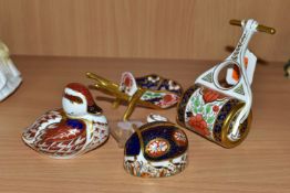 THREE ROYAL CROWN DERBY PAPERWEIGHTS TOGETHER WITH A ROYAL CROWN DERBY MINIATURE WHEELBARROW,