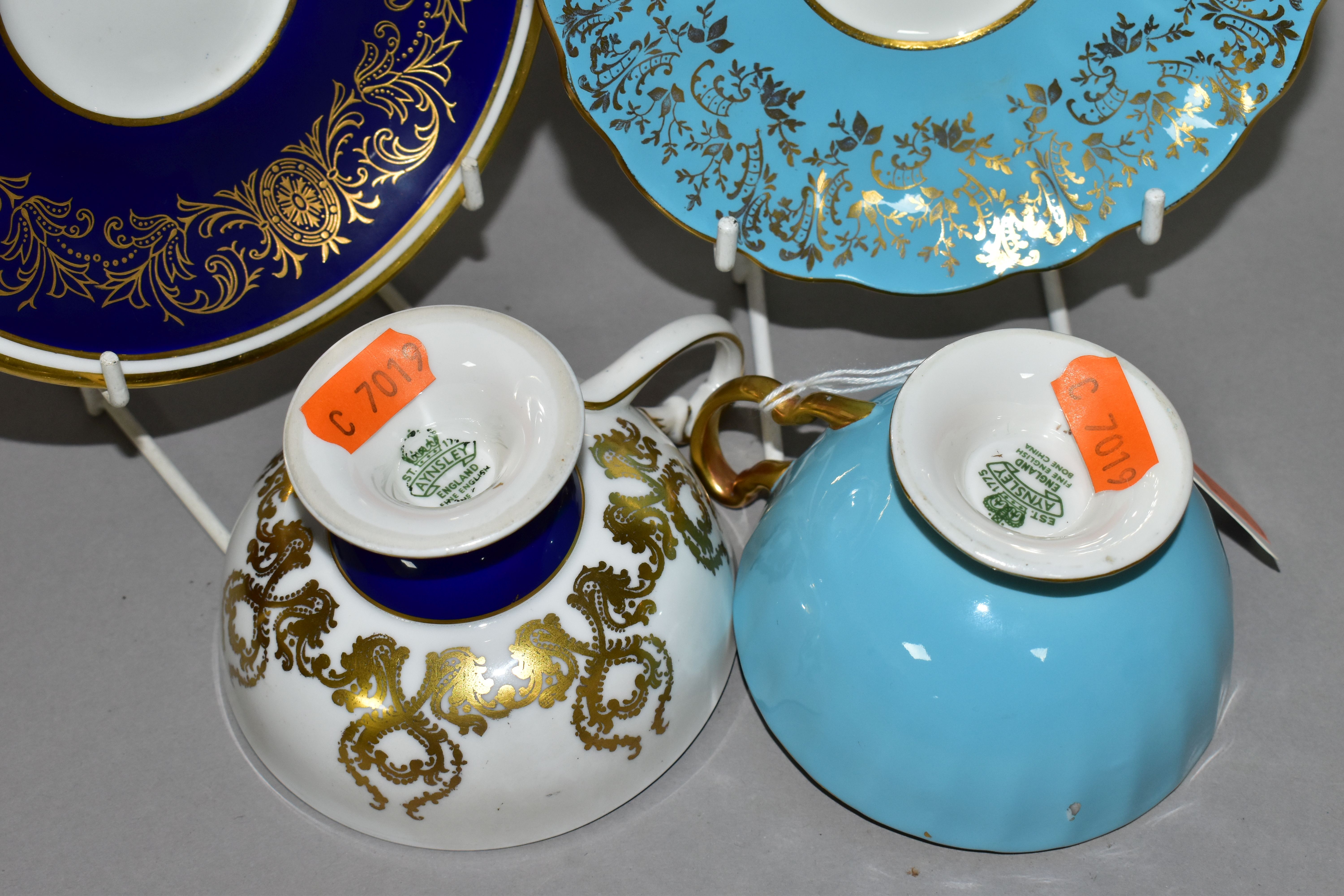 TWO AYNSLEY CABINET TEACUPS AND SAUCERS, comprising a turquoise cup and saucer, the interior of - Image 5 of 8