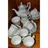 A TWENTY ONE PIECE JOHNSON BROTHERS ETERNAL BEAU TEA SET, comprising a teapot, milk jug, sugar bowl,