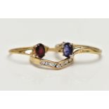 THREE 9CT GOLD GEM SET RINGS, the first designed with a four claw set, oval cut tanzanite, flanked