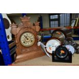 A GROUP OF SEVEN CLOCKS, comprising a chrome alarm clock, quartz black mantel clock, a wooden '