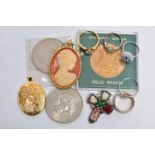 A BAG OF ASSORTED ITEMS, to include a silver gilt oval locket, decorated with a floral pattern to