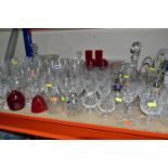 A LARGE QUANTITY OF CUT CRYSTAL AND CRANBERRY GLASSWARE, comprising a silver topped perfume