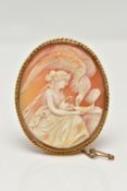A YELLOW METAL CAMEO BROOCH, of an oval form, carved shell cameo depicting Hebe and Zeus in eagle