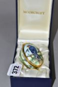A BOXED MOORCROFT ENAMELS TRINKET BOX, of oval form, decorated in the 'Swallows' pattern, with