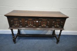 A 20TH CENTURY OAK SIDE TABLE, with two drawers, with geometric design, on turned legs, united by