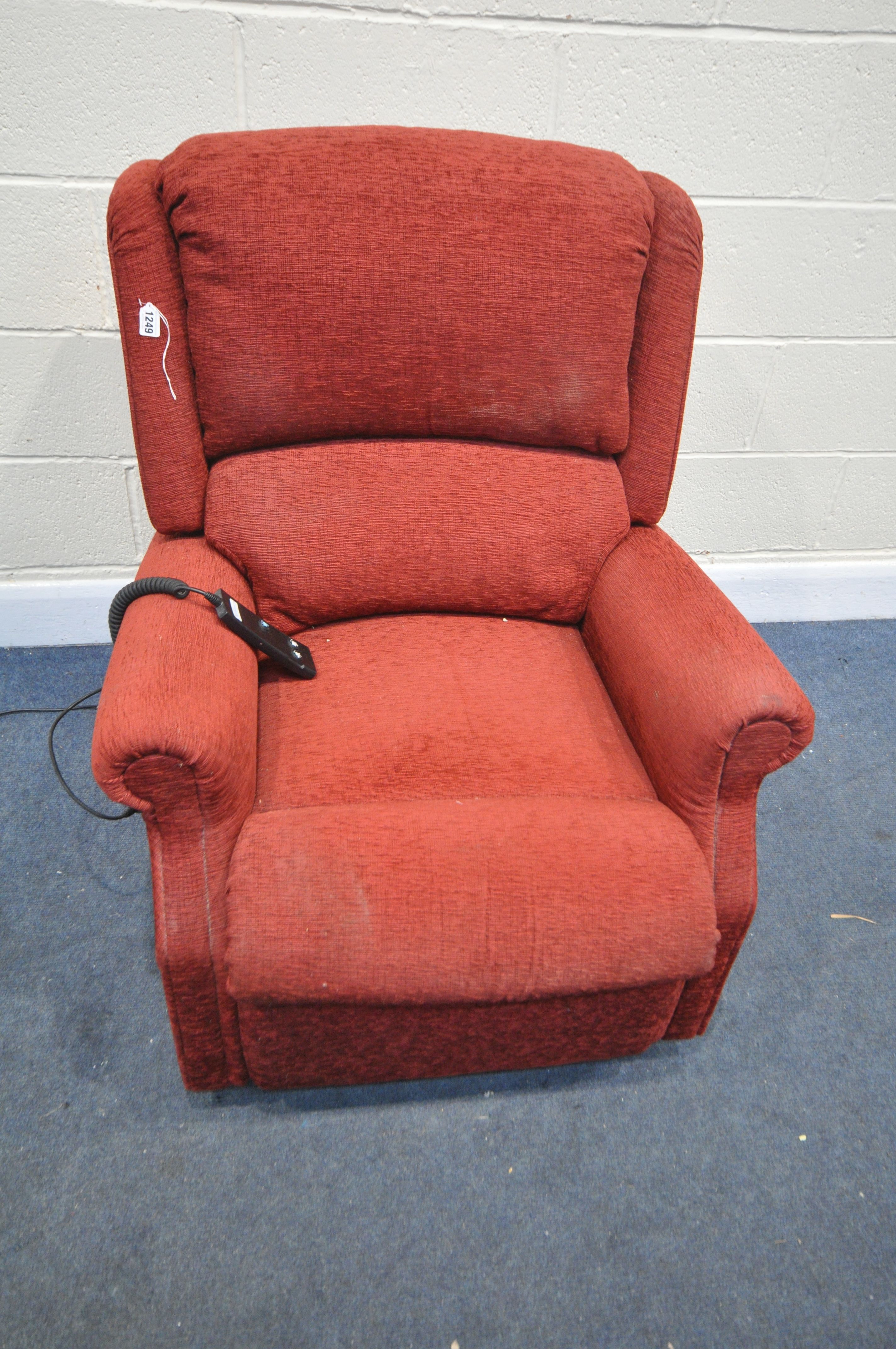 A CELEBRITY RED UPHOLSTERED ELECTRIC RISE AND RECLININER (PAT pass and working, condition:-fabric
