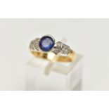 A SAPPHIRE AND DIAMOND DRESS RING, set with an oval cut sapphire, within a partial collet setting,
