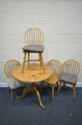 A PINE CIRCULAR PEDESTAL DINING TABLE, diameter 92cm x height 76cm, and four beech hoop back chairs,