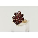 A 9CT YELLOW GOLD GARNET CLUSTER RING, of a marquise shape outline set with marquise and circular