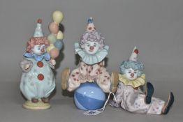 THREE LLADRO CLOWNS, comprising 'Littlest Clown' 5811, 'Having a Ball' 5813, 'Tired Friend' 5812,