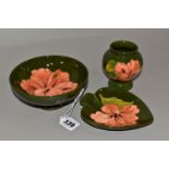 A MOORCOFT THREE PIECE SET, comprising a small pedestal dish, diameter 14cm, a bud vase, height 9cm,