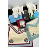 A CASE OF MASONIC REGALIA, to include two aprons, various books, year books, by laws etc., three