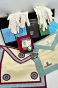 A CASE OF MASONIC REGALIA, to include two aprons, various books, year books, by laws etc., three
