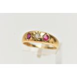 AN EARLY 20TH CENTURY 18CT GOLD, RUBY AND DIAMOND RING, centering on a star set, old cut diamond,