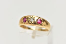AN EARLY 20TH CENTURY 18CT GOLD, RUBY AND DIAMOND RING, centering on a star set, old cut diamond,
