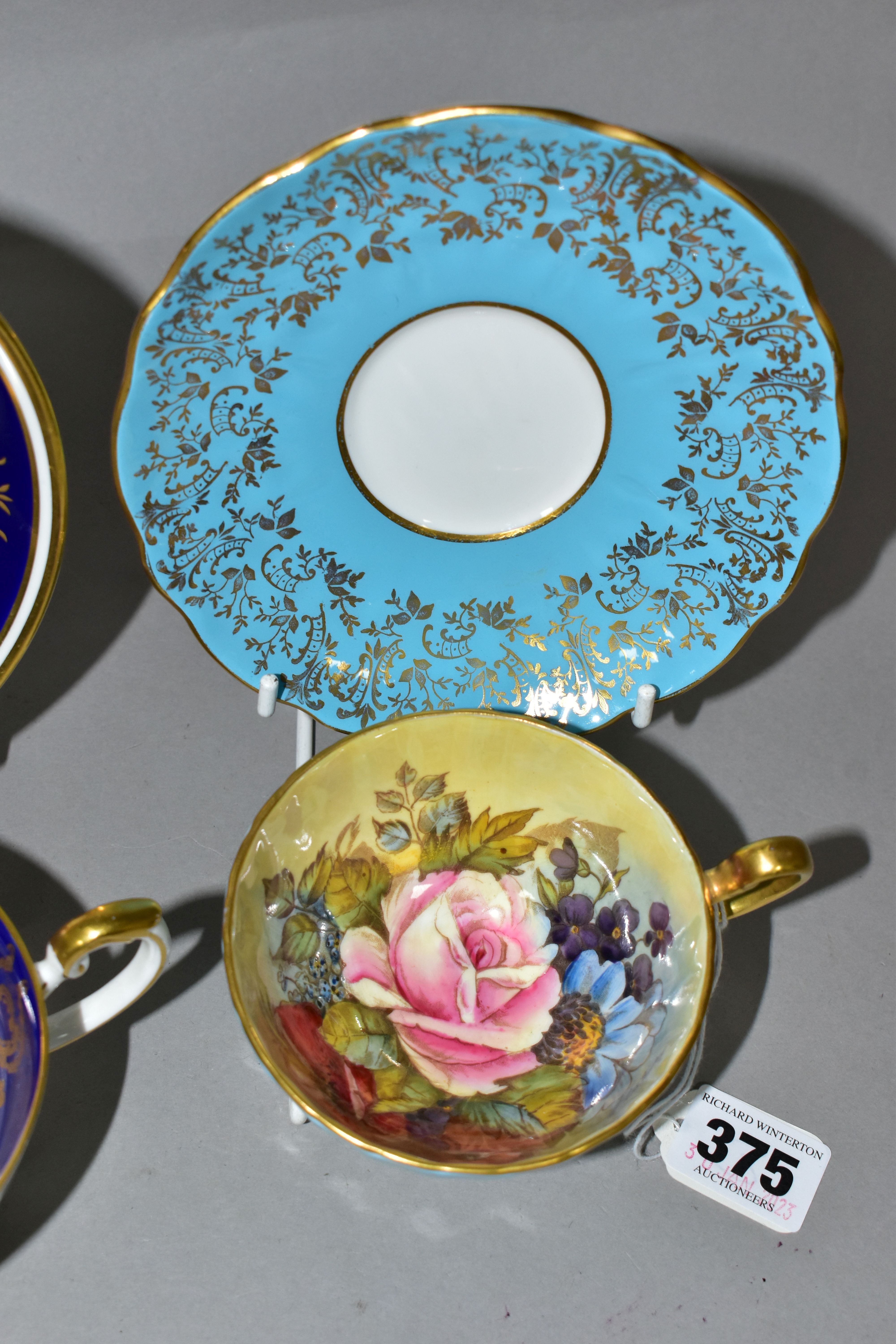 TWO AYNSLEY CABINET TEACUPS AND SAUCERS, comprising a turquoise cup and saucer, the interior of - Image 3 of 8