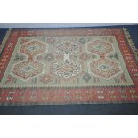 A 20TH CENTURY WOOLLEN MOROCCAN GEOMETRIC RUG, 240cm x 159cm, along with a modern blue rug, and a