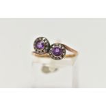 A 19TH CENTURY TOI ET MOI RING, two circular cut amethyst stones, set with a surround of rose cut